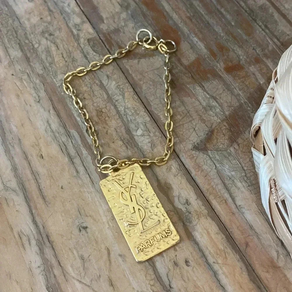 Yves Saint Laurent - Authentic YSL Parfums zipper pull gold color on short chain
